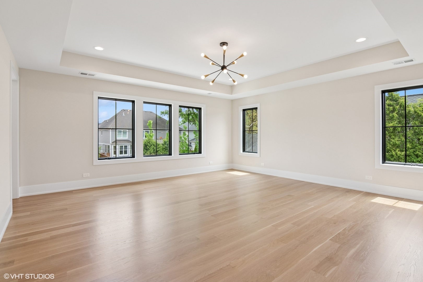 613 Chatham Avenue Elmhurst, IL 60126 - Photo 17 of 37 a view of an empty room with wooden floor and a window