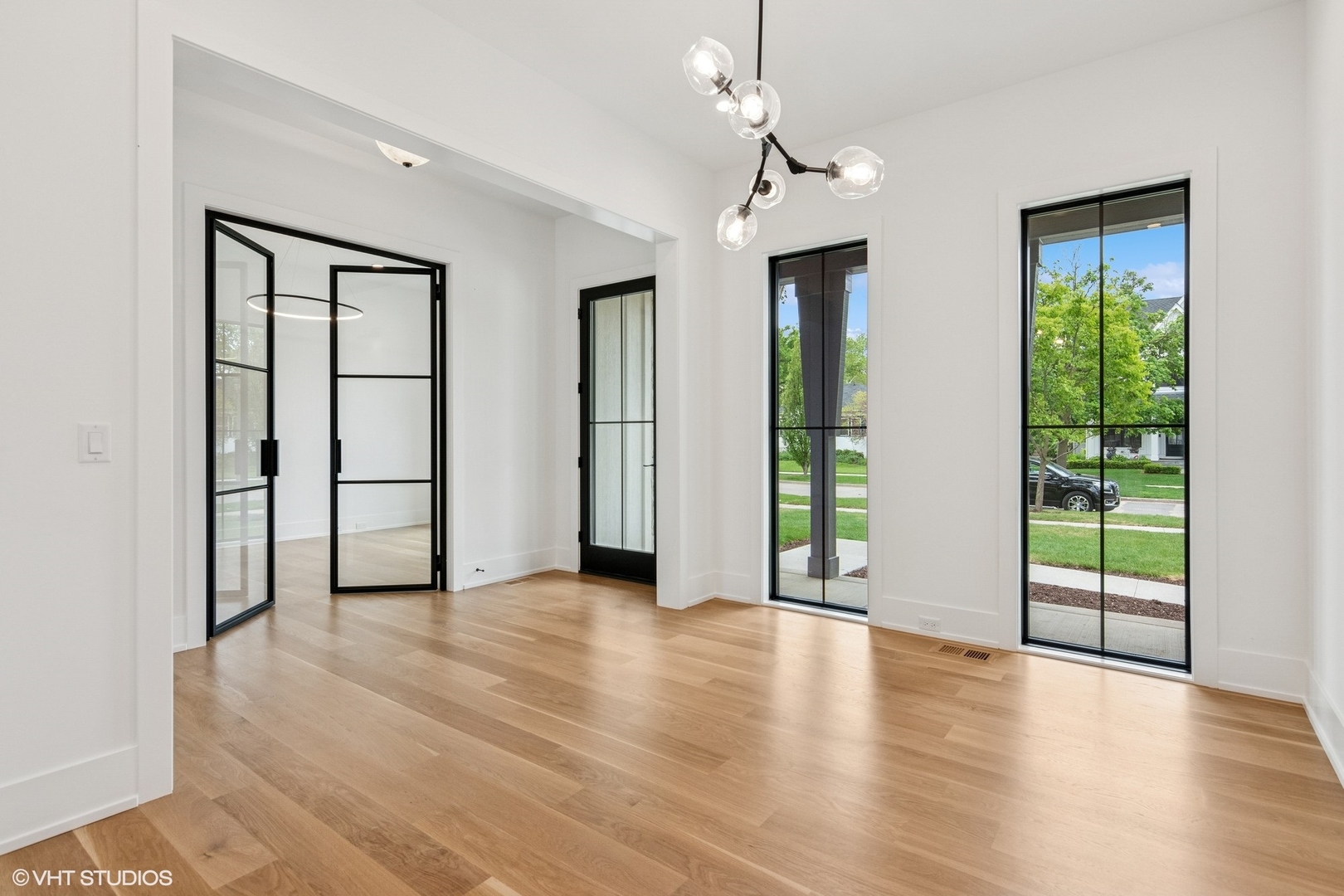 613 Chatham Avenue Elmhurst, IL 60126 - Photo 2 of 37 an empty room with wooden floor and windows