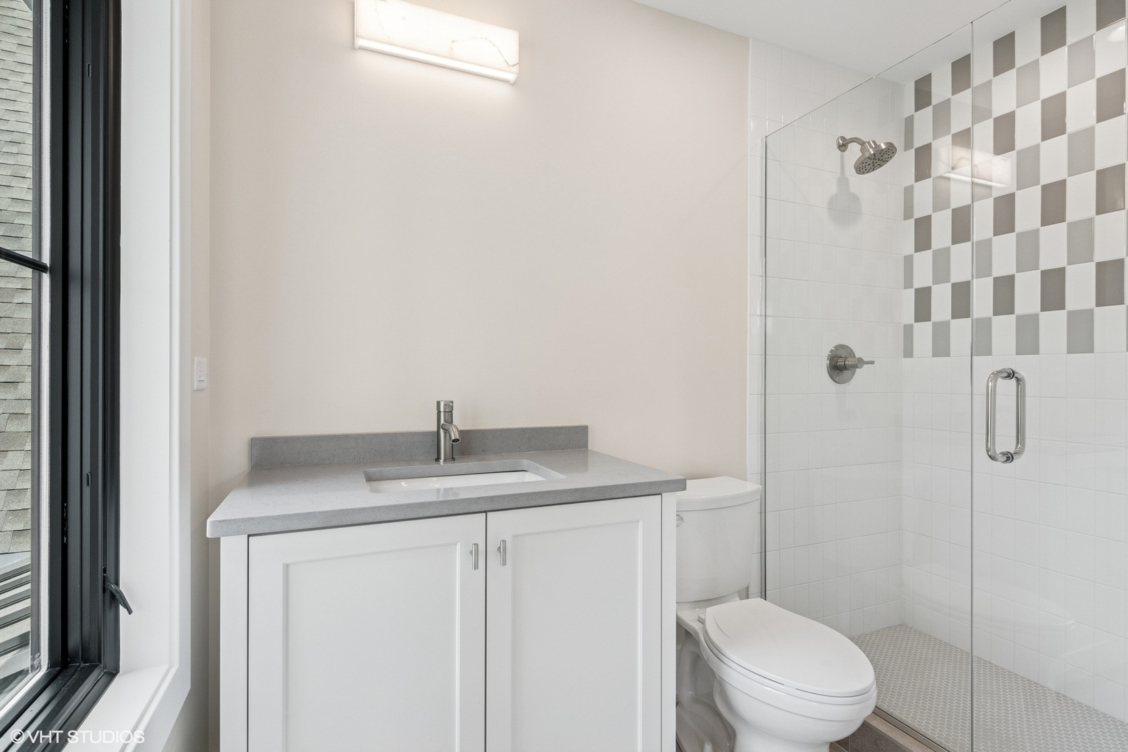 613 Chatham Avenue Elmhurst, IL 60126 - Photo 24 of 37 a bathroom with a granite countertop sink a toilet and shower