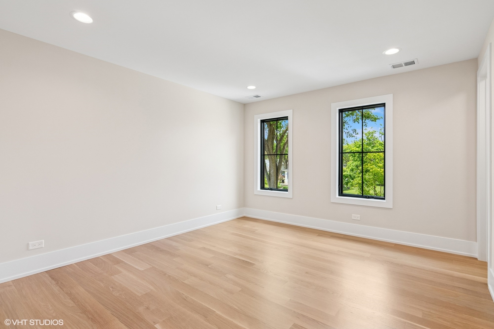 613 Chatham Avenue Elmhurst, IL 60126 - Photo 25 of 37 an empty room with wooden floor and windows
