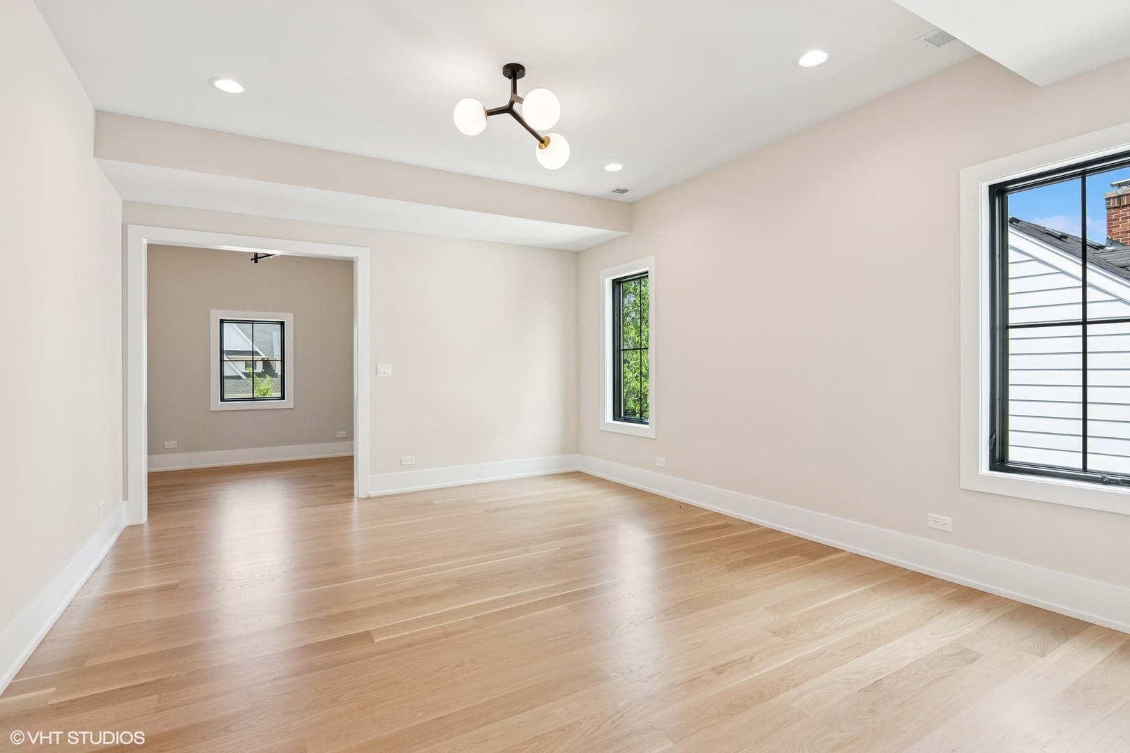 613 Chatham Avenue Elmhurst, IL 60126 - Photo 27 of 37 an empty room with wooden floor and windows