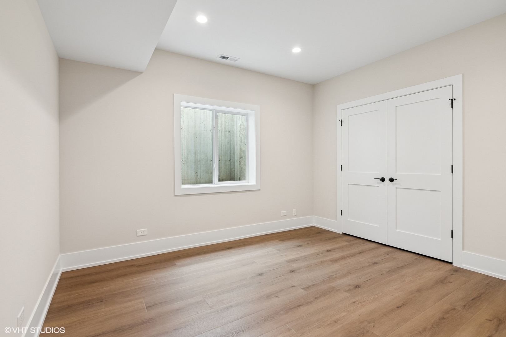 613 Chatham Avenue Elmhurst, IL 60126 - Photo 34 of 37 a view of an empty room with wooden floor and a window