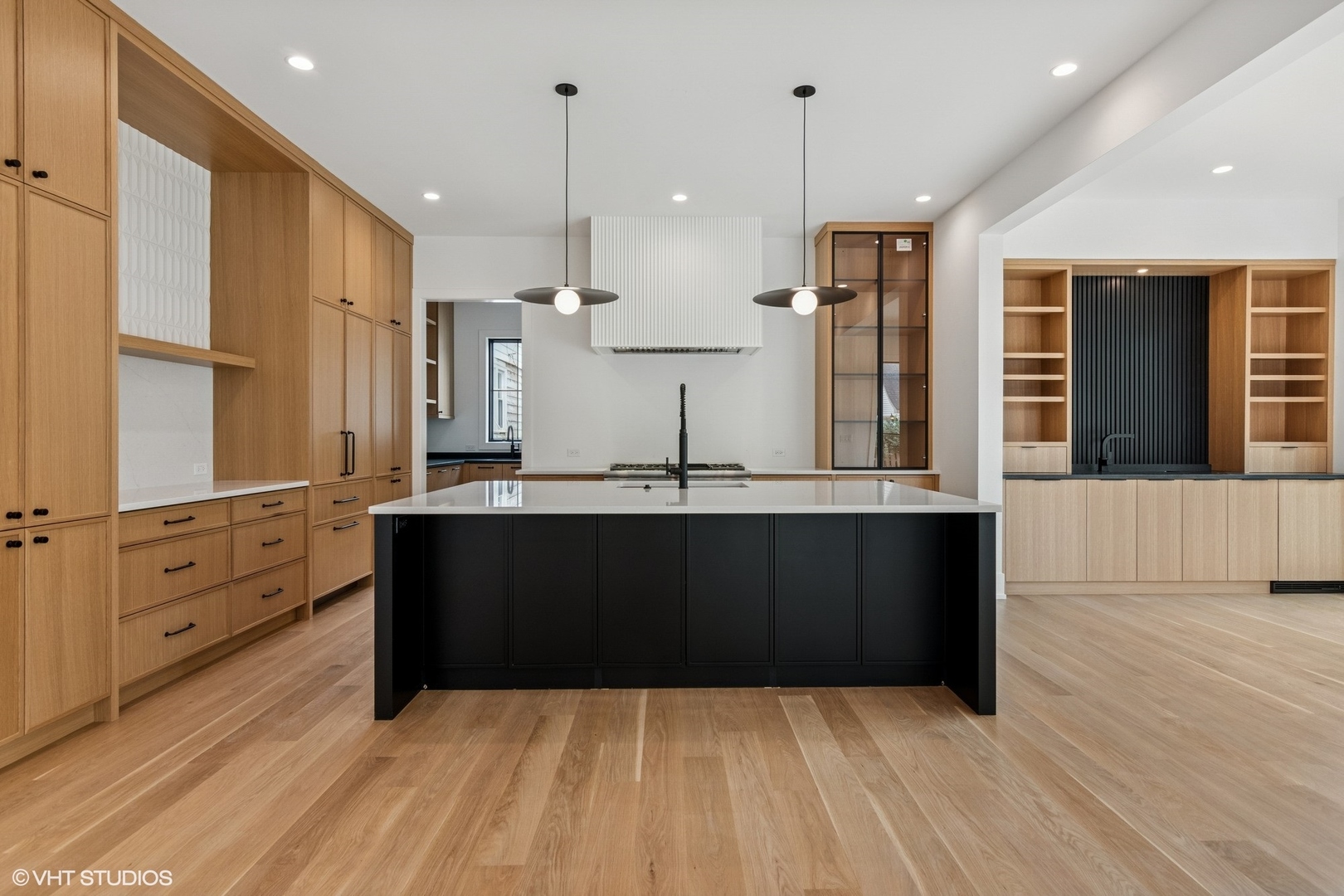 613 Chatham Avenue Elmhurst, IL 60126 - Photo 6 of 37 a view of kitchen with stainless steel appliances kitchen island granite countertop white cabinets and wooden floor