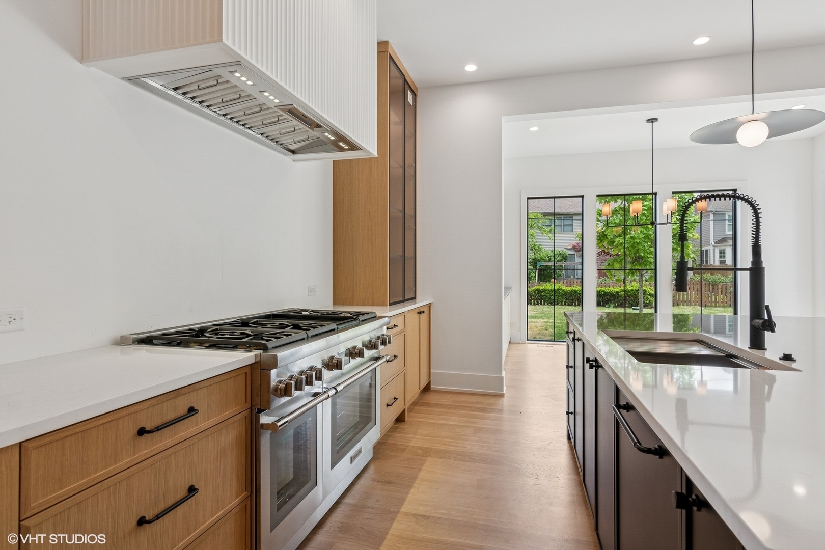 613 Chatham Avenue Elmhurst, IL 60126 - Photo 7 of 37 a kitchen with stainless steel appliances granite countertop a stove and a sink