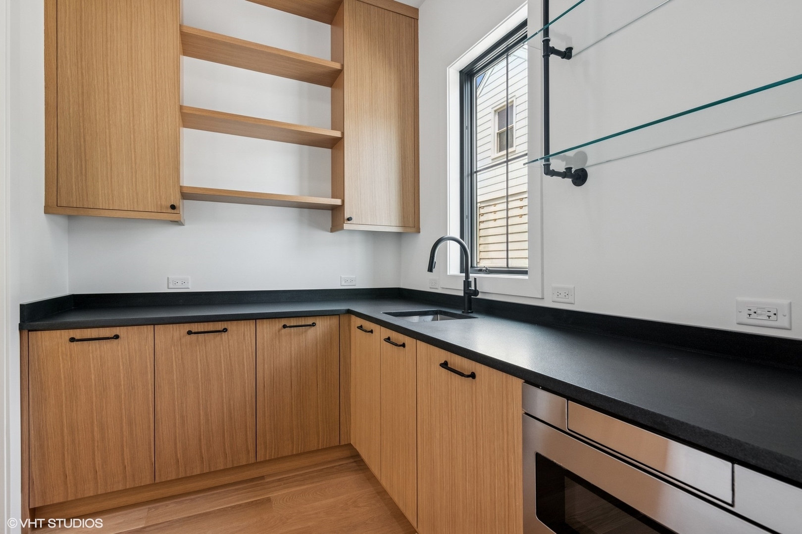 613 Chatham Avenue Elmhurst, IL 60126 - Photo 9 of 37 a kitchen with a sink and cabinets