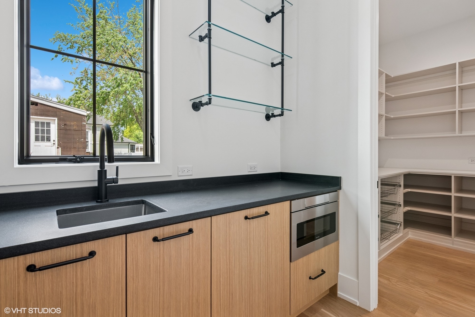 613 Chatham Avenue Elmhurst, IL 60126 - Photo 10 of 37 a kitchen with a cabinets and window