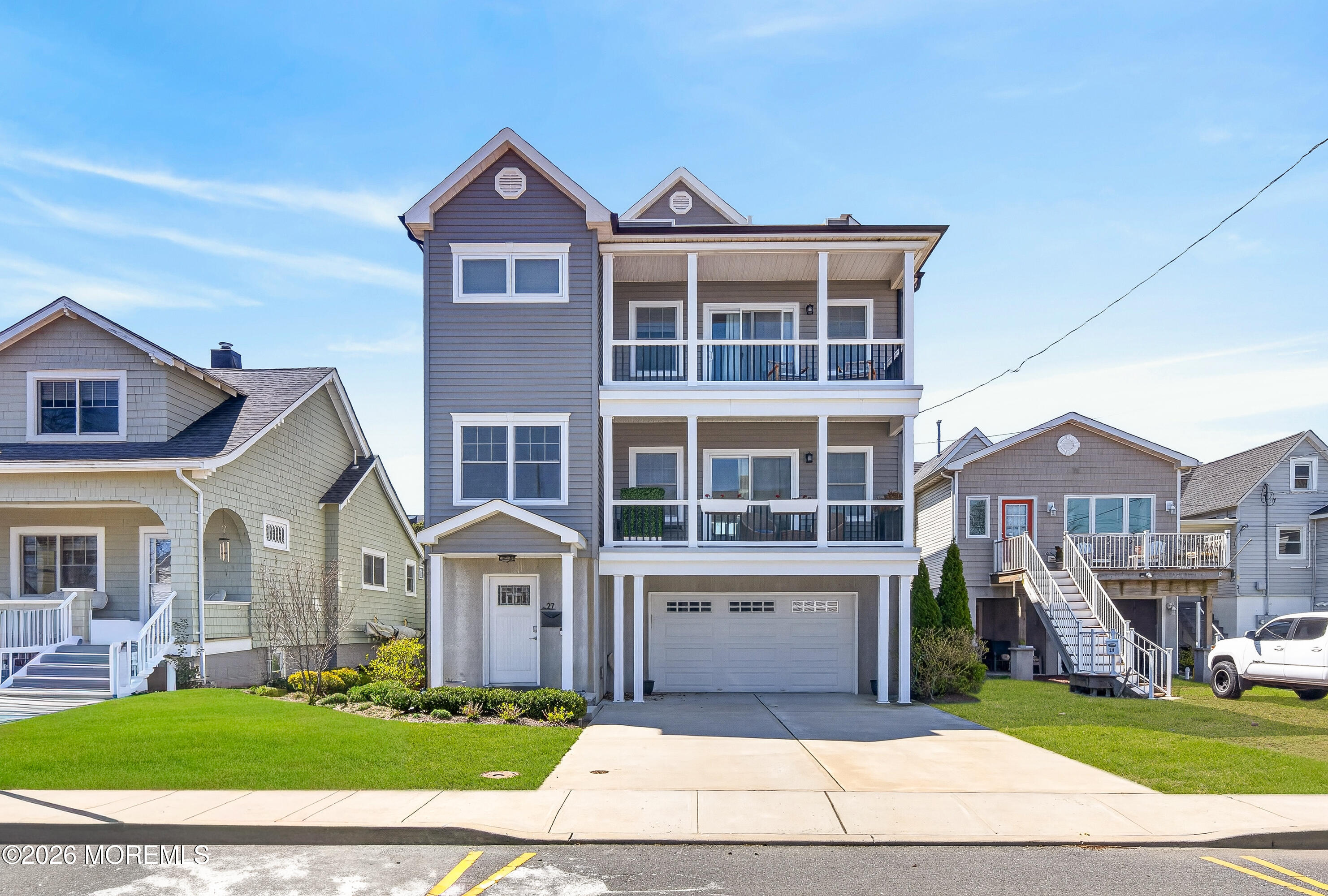 27 5th Street Highlands, NJ 07732 - Photo 51 of 62 a front view of a house with a yard
