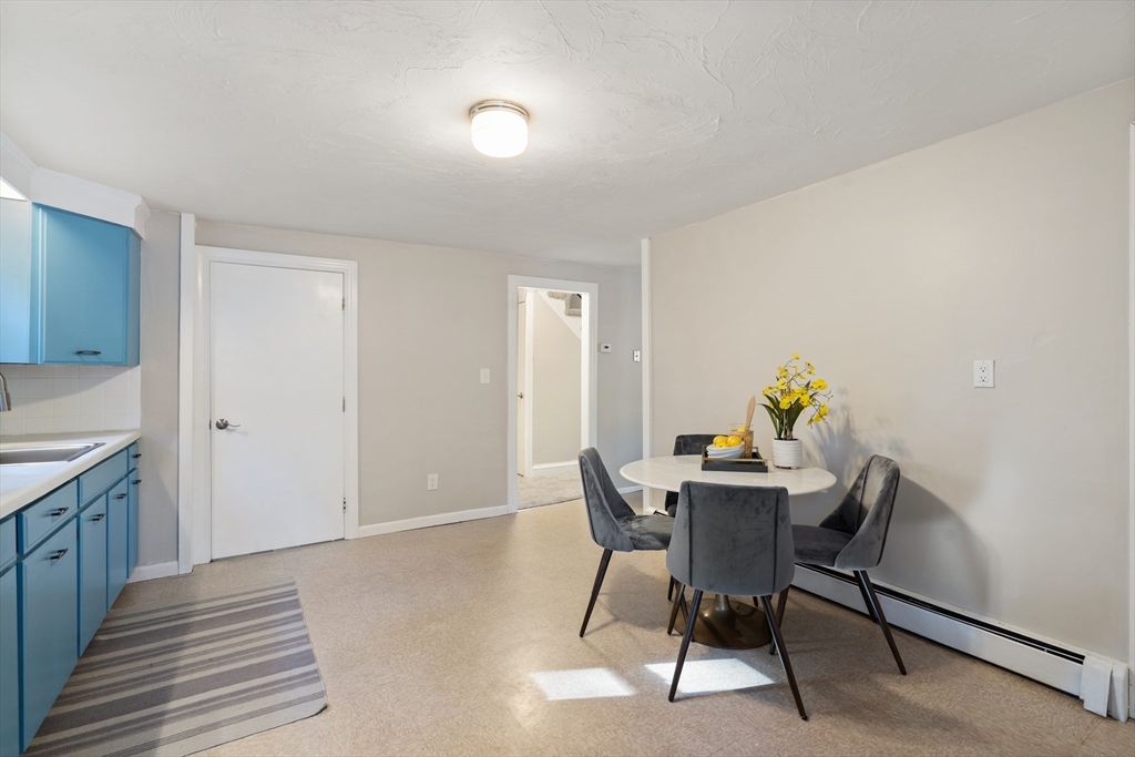 27 Water Street Concord, MA 01742 - Photo 11 of 21 a view of a dining room with furniture and wooden floor