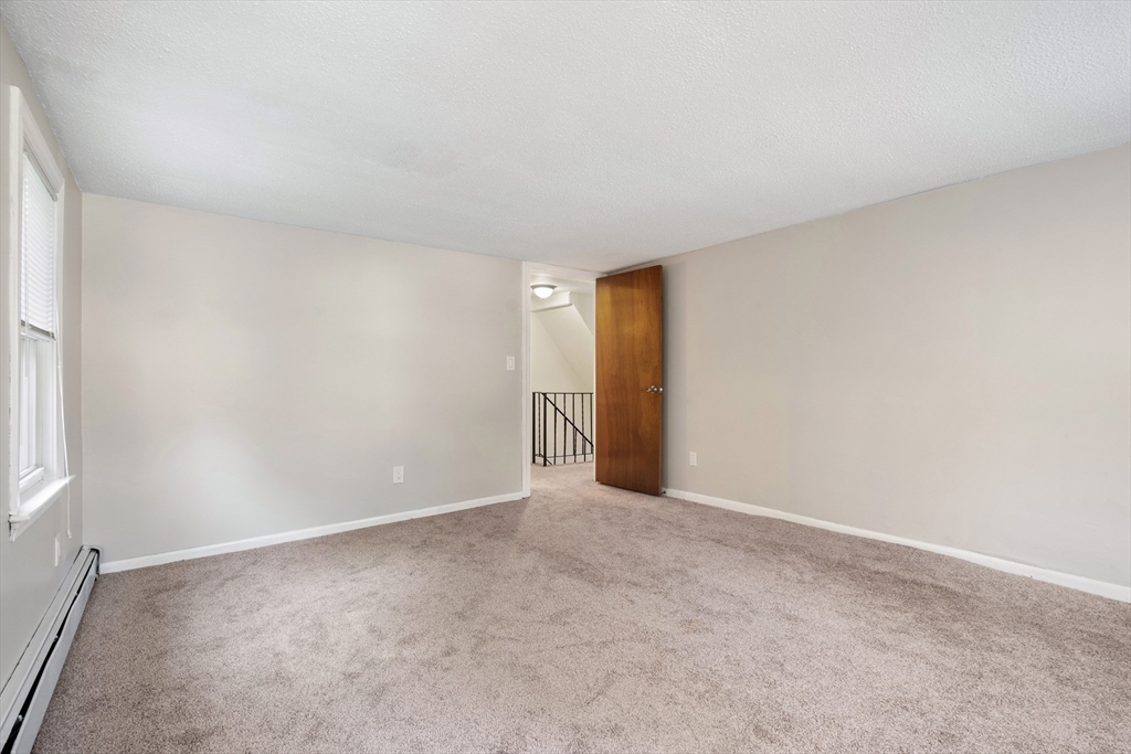 27 Water Street Concord, MA 01742 - Photo 15 of 21 a view of an empty room and a window