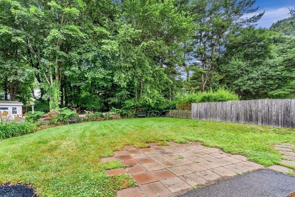 27 Water Street Concord, MA 01742 - Photo 21 of 21 a view of backyard with a wooden fence