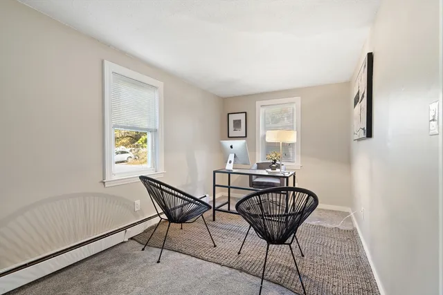 a view of a livingroom with furniture and window