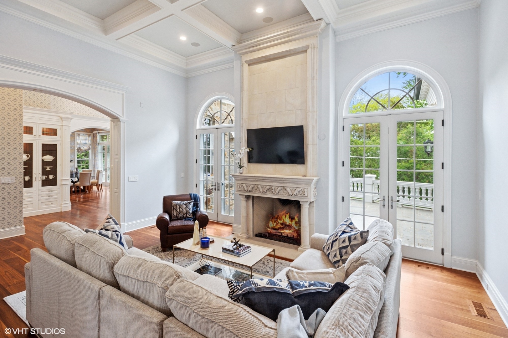 78 Wagner Road Northfield, IL 60093 - Photo 13 of 66 a living room with furniture a fireplace and a floor to ceiling window