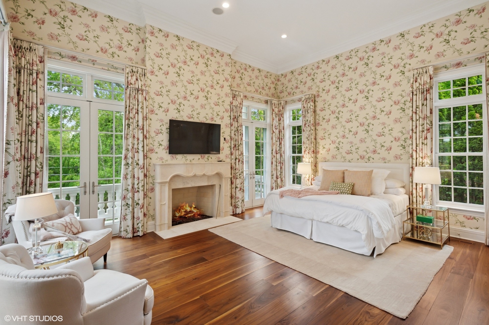 78 Wagner Road Northfield, IL 60093 - Photo 23 of 66 a spacious bedroom with a bed and a fireplace