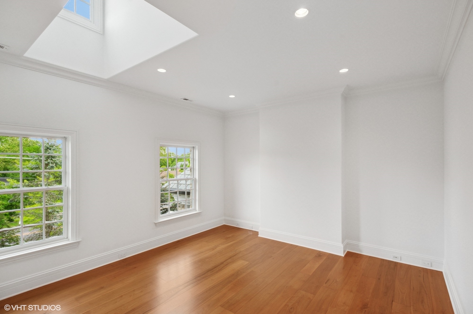 78 Wagner Road Northfield, IL 60093 - Photo 36 of 66 an empty room with wooden floor and windows
