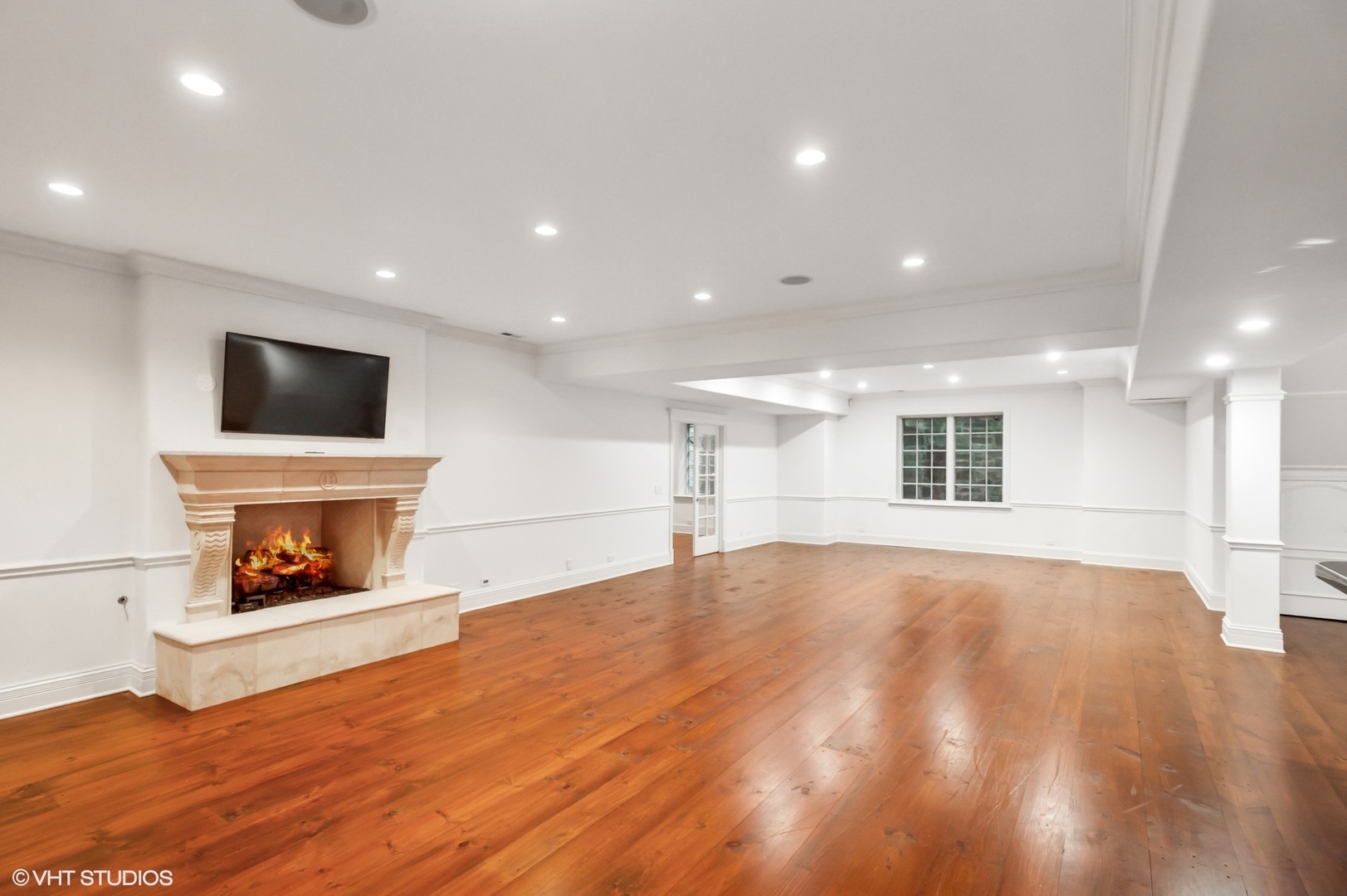 78 Wagner Road Northfield, IL 60093 - Photo 40 of 66 a view of an empty room with a fireplace and a window