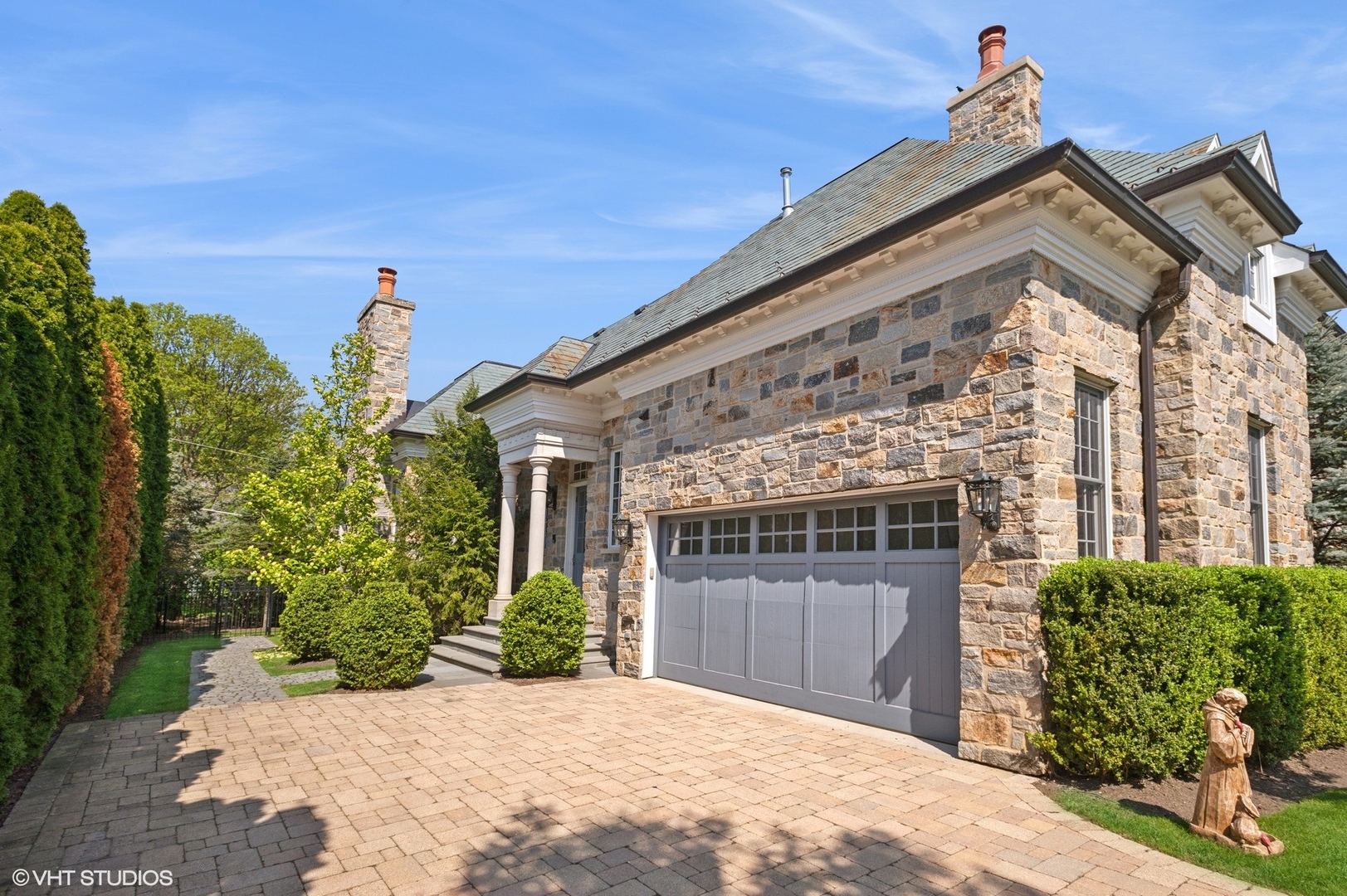 78 Wagner Road Northfield, IL 60093 - Photo 52 of 66 a view of a house with a yard and potted plants