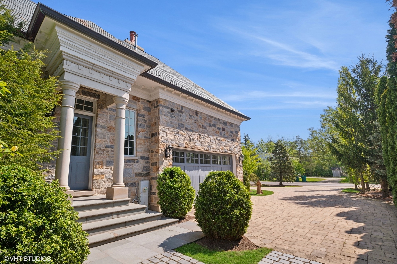 78 Wagner Road Northfield, IL 60093 - Photo 53 of 66 a front view of a house with garden