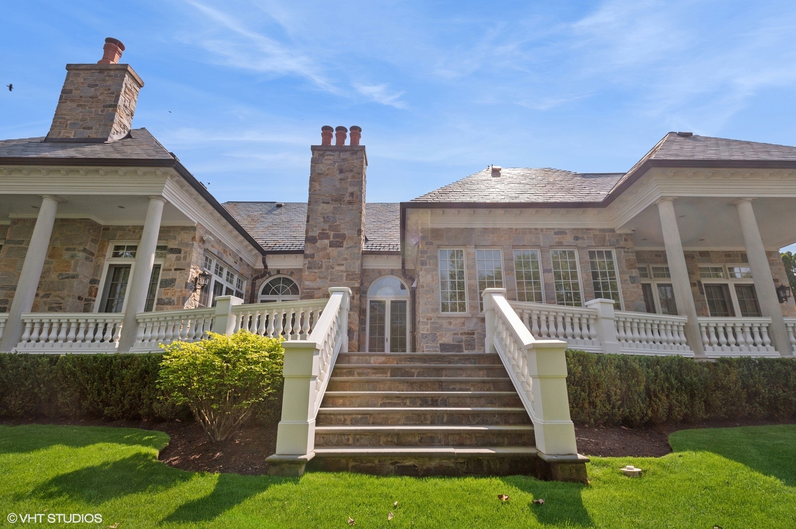 78 Wagner Road Northfield, IL 60093 - Photo 56 of 66 a front view of a house with a garden and plants