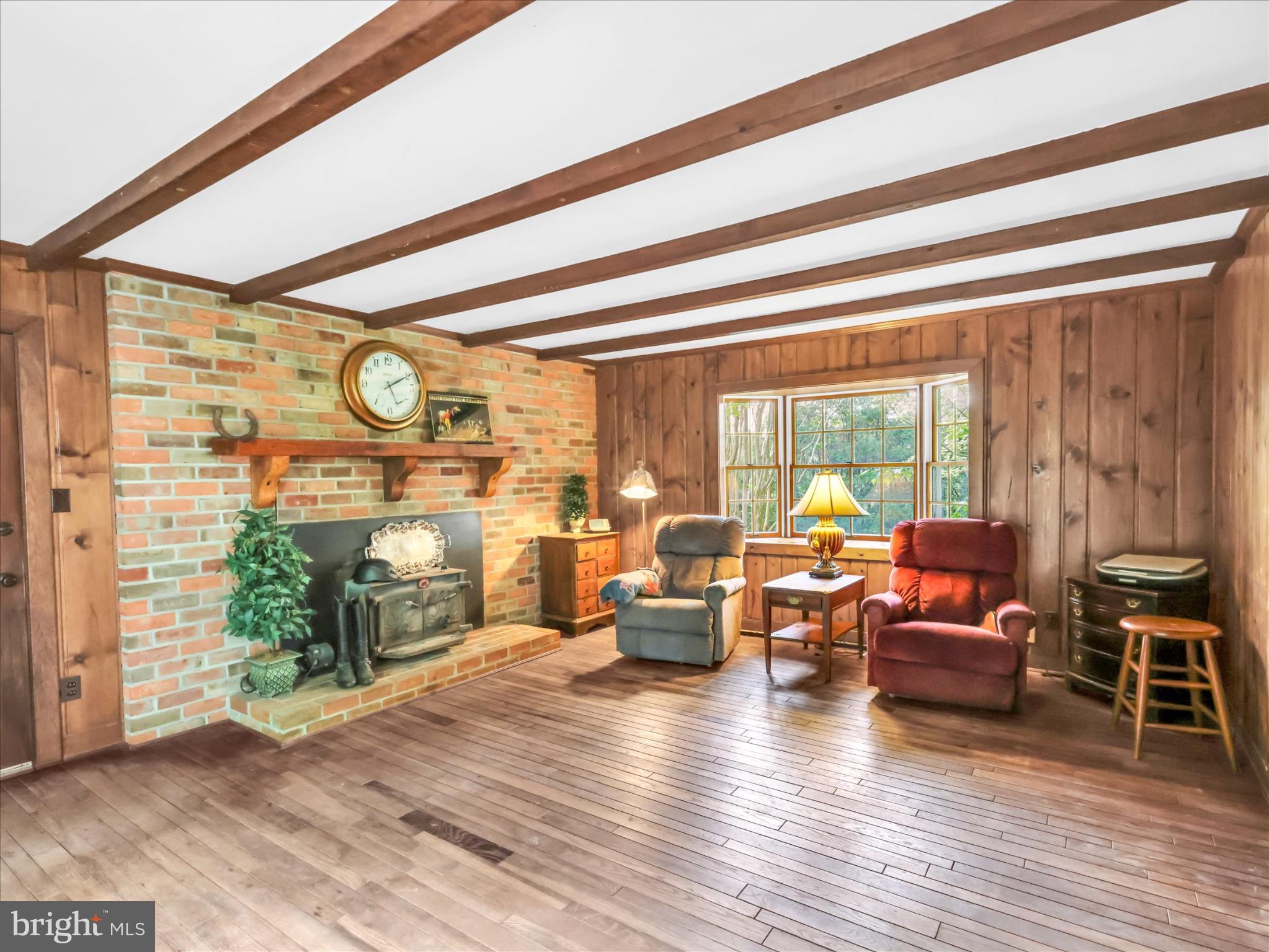 19255 Telegraph Springs Road Purcellville, VA 20132 - Photo 20 of 107 a living room with furniture and wooden floor