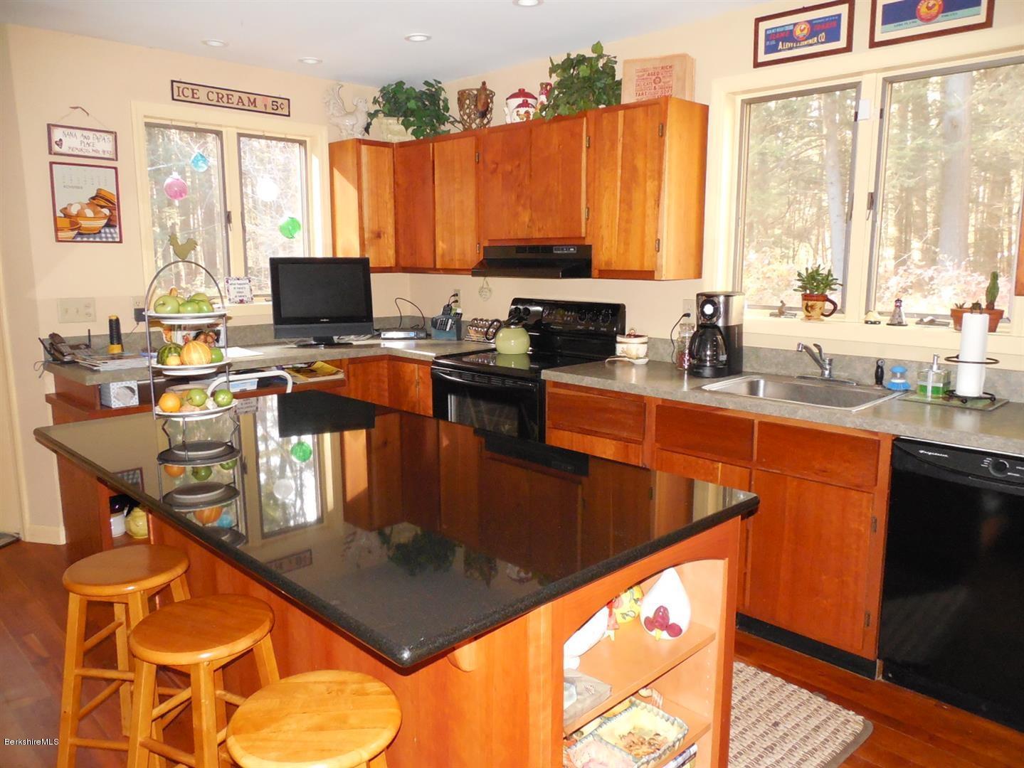 34 Glendale Road Stockbridge, MA 01262 - Photo 12 of 24 a kitchen with a stove a sink and a microwave