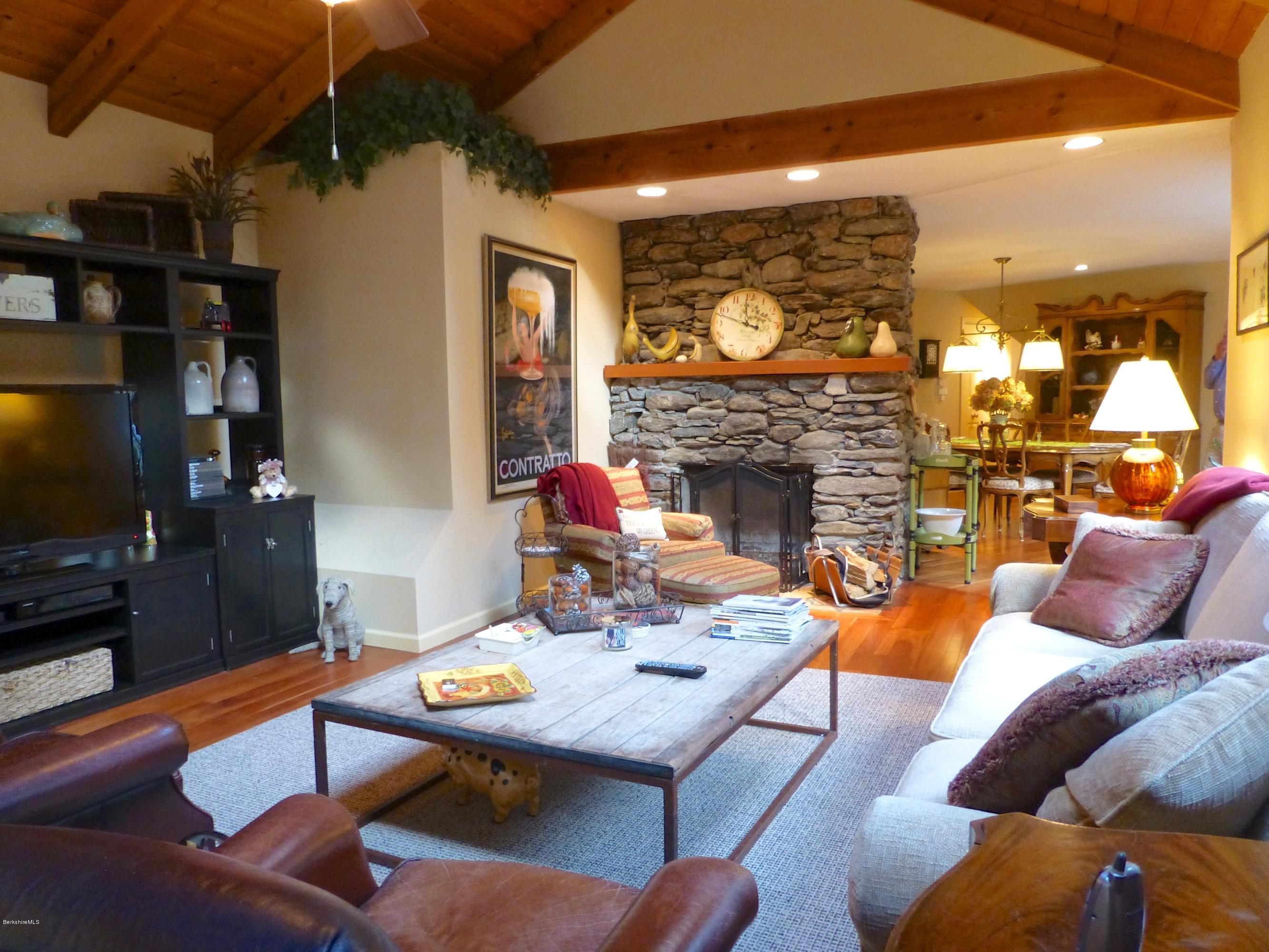 34 Glendale Road Stockbridge, MA 01262 - Photo 4 of 24 a living room with fireplace furniture and a flat screen tv