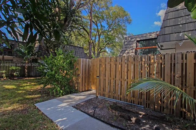 a view of a backyard with pathway