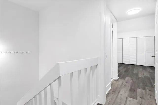 a view of a hallway with staircase