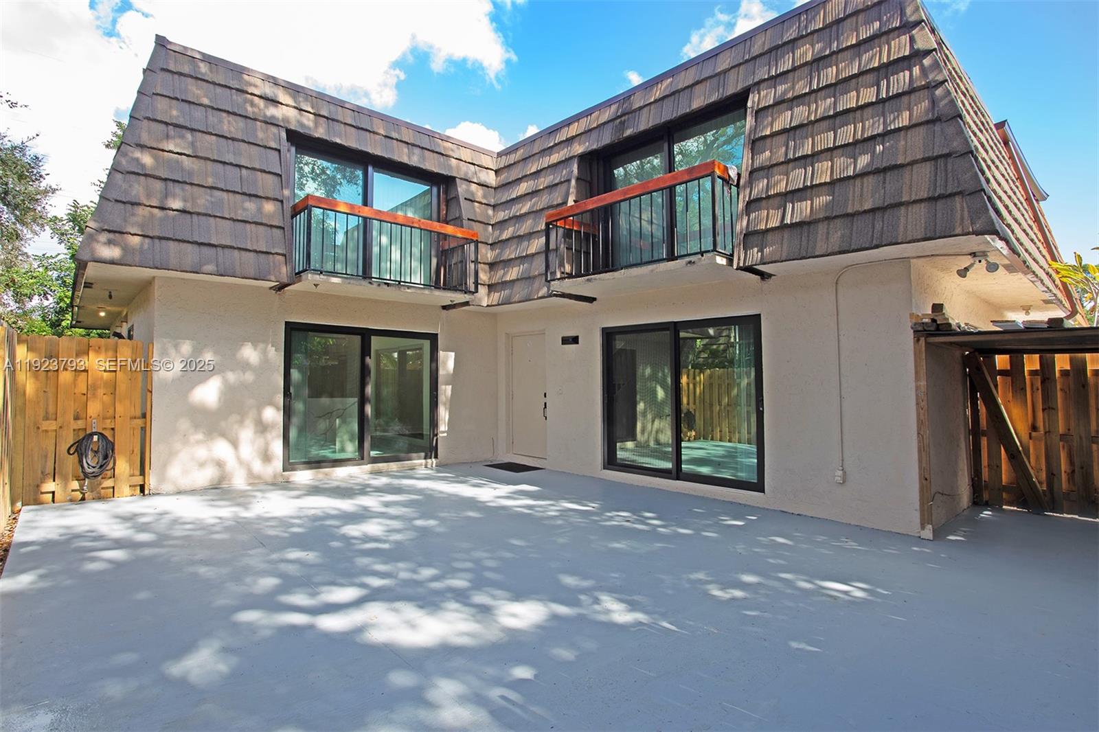 4059 Palm Bay Circle, Unit C West Palm Beach, FL 33406 - Photo 2 of 27 a view of a building with a porch