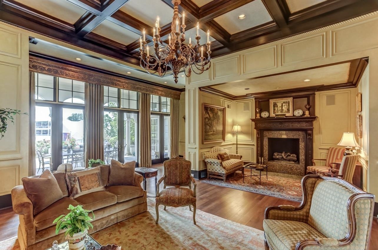 8575 The Island Memphis, TN 38125 - Photo 11 of 40 a living room with furniture a chandelier and a large window
