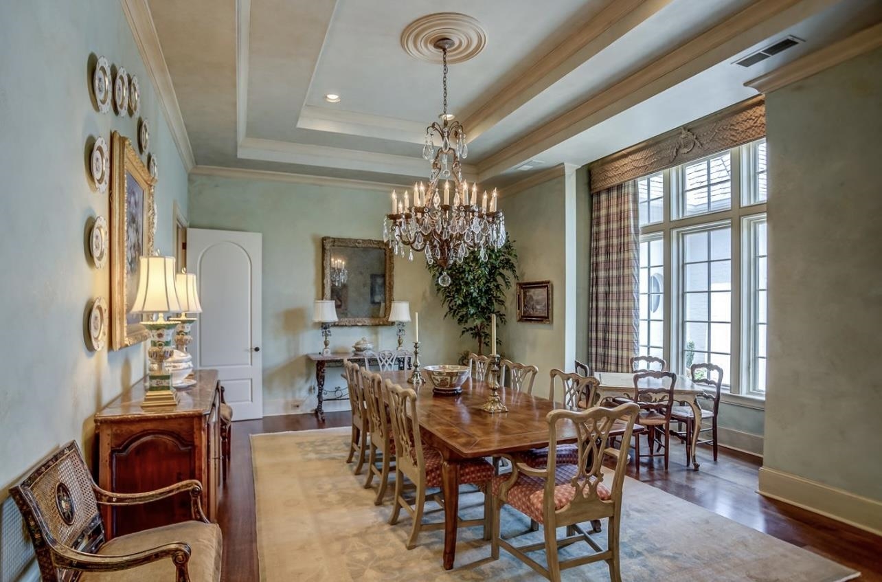 8575 The Island Memphis, TN 38125 - Photo 12 of 40 a view of a dining room with furniture and chandelier