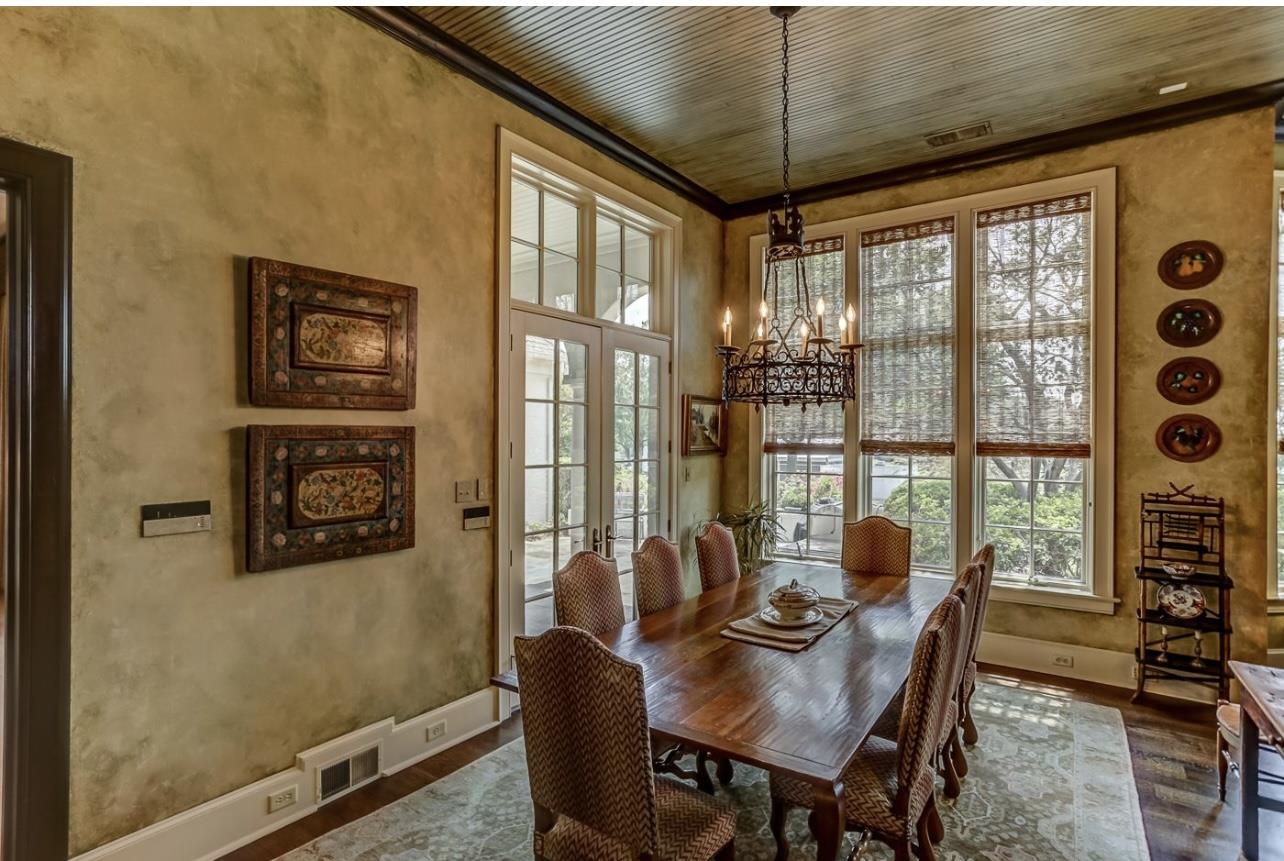 8575 The Island Memphis, TN 38125 - Photo 16 of 40 a view of a dining room with furniture window and outside view