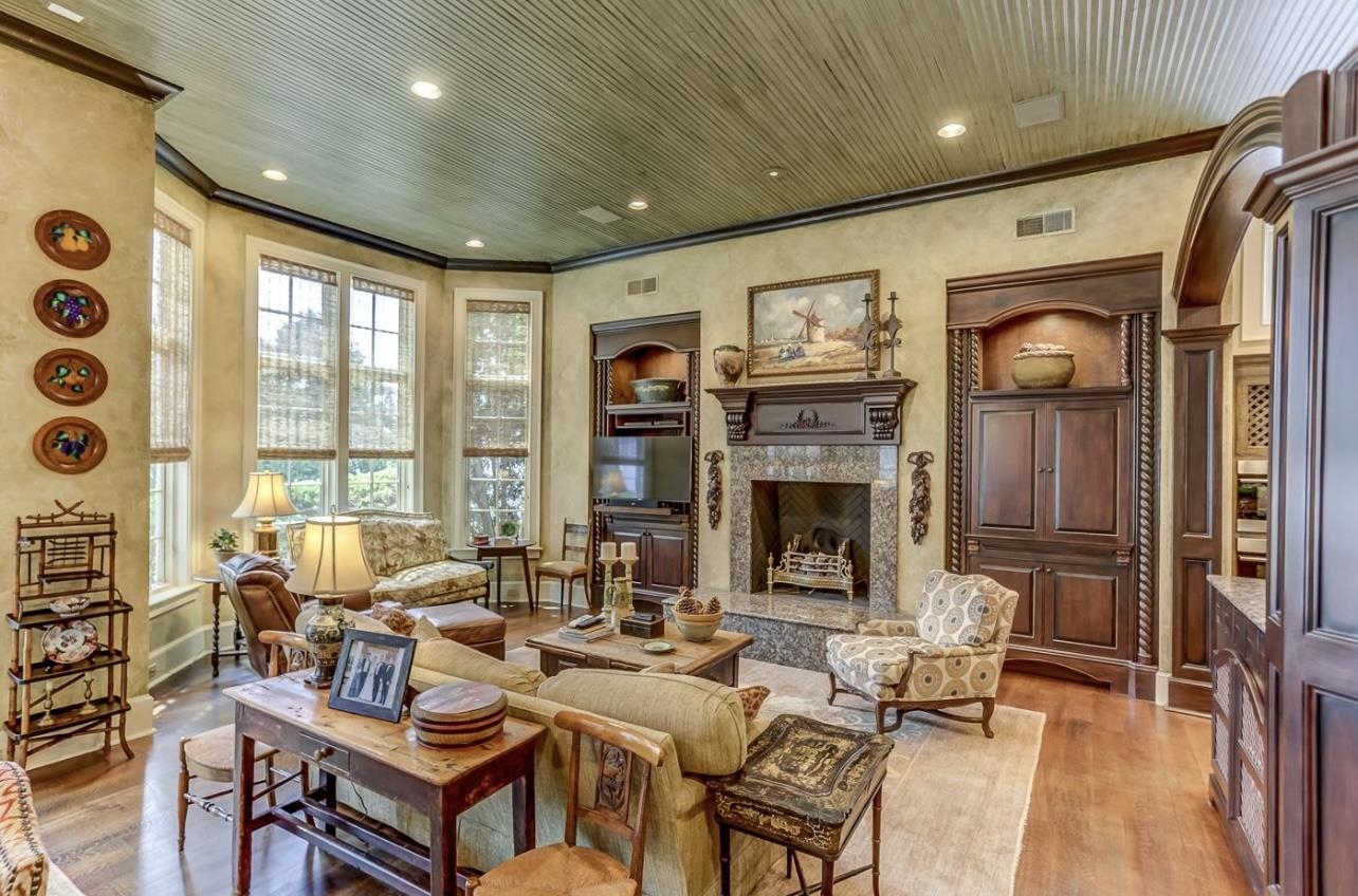 8575 The Island Memphis, TN 38125 - Photo 20 of 40 a living room with fireplace furniture and a large window