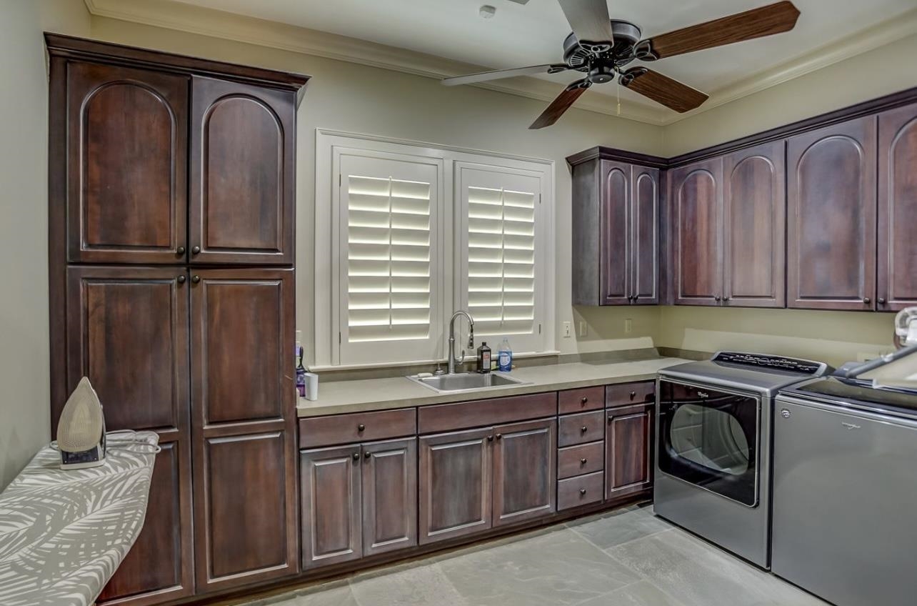 8575 The Island Memphis, TN 38125 - Photo 21 of 40 a kitchen with a refrigerator sink and cabinets