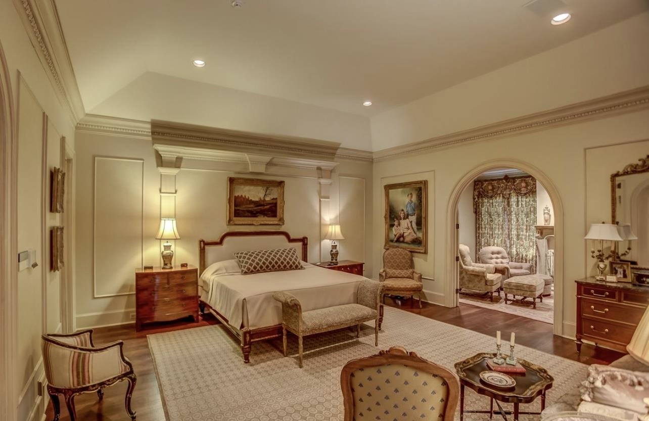 8575 The Island Memphis, TN 38125 - Photo 23 of 40 a bedroom with a bed and wooden floor