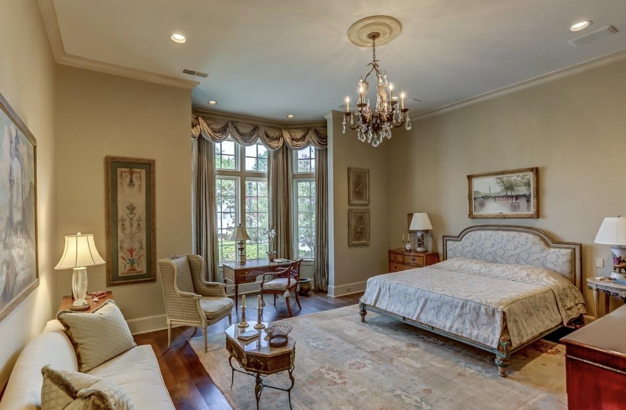 8575 The Island Memphis, TN 38125 - Photo 26 of 40 a bedroom with a bed ceiling fan and a window