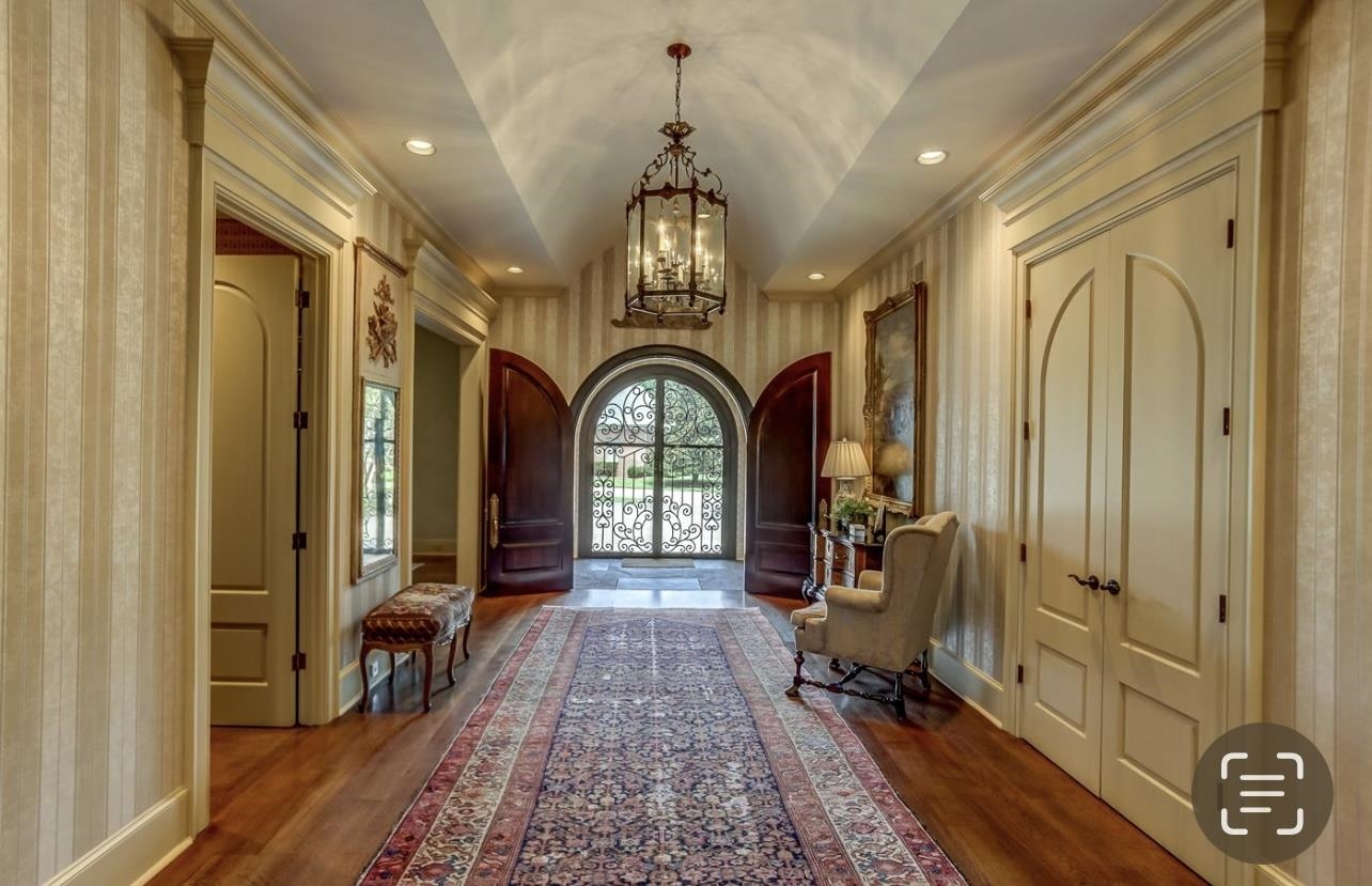 8575 The Island Memphis, TN 38125 - Photo 6 of 40 a view of a entryway door with wooden floor