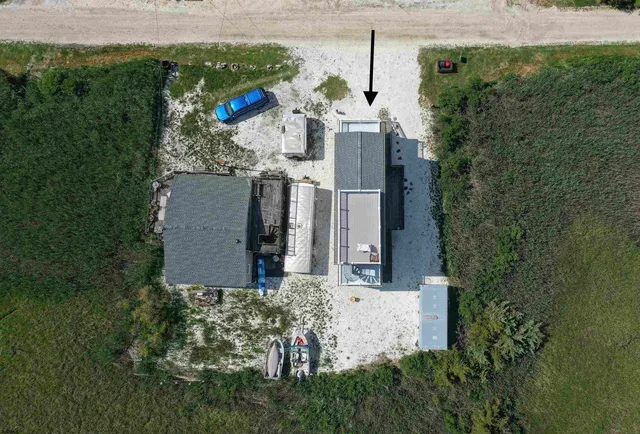 a top view of a house with backyard porch and outdoor seating