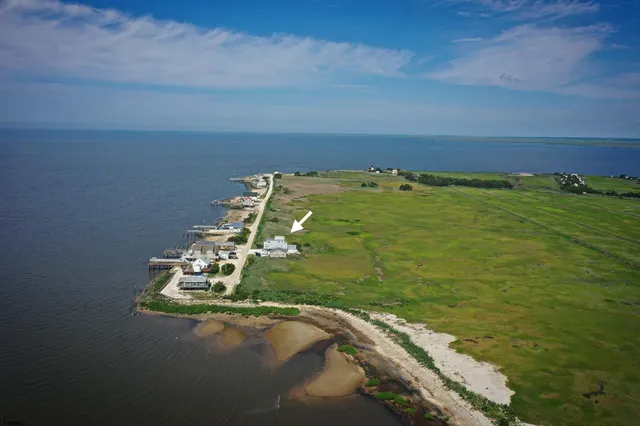 a view of a house with wooden deck