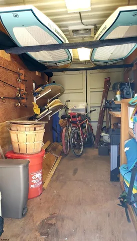 a living room with furniture a large window with kitchen view