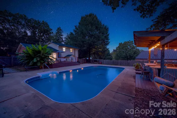 a view of a swimming pool with a patio