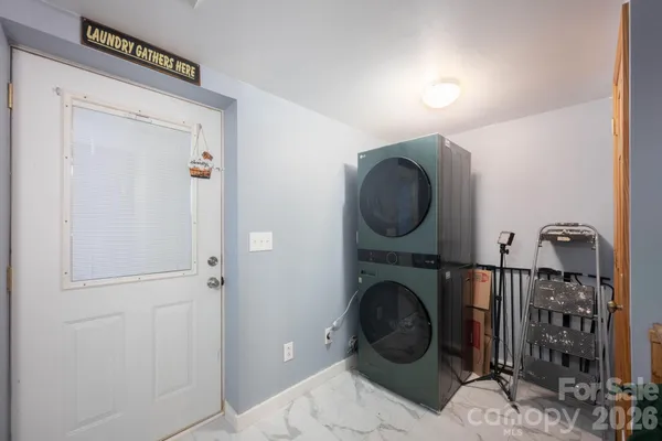 a view of a hallway with washer and dryer