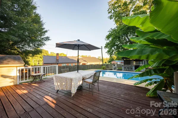 a view of a swimming pool with a patio