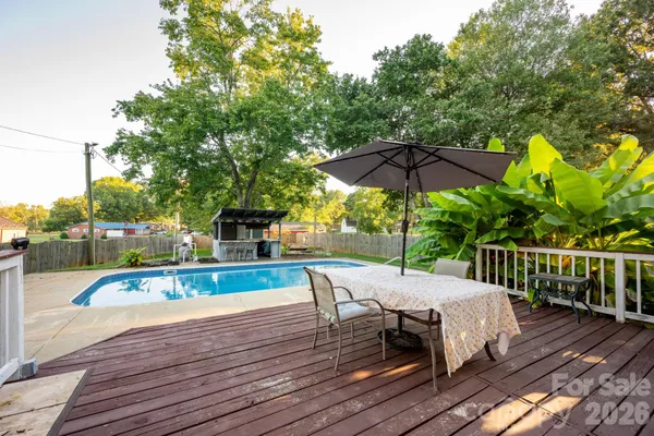 a view of swimming pool with a yard
