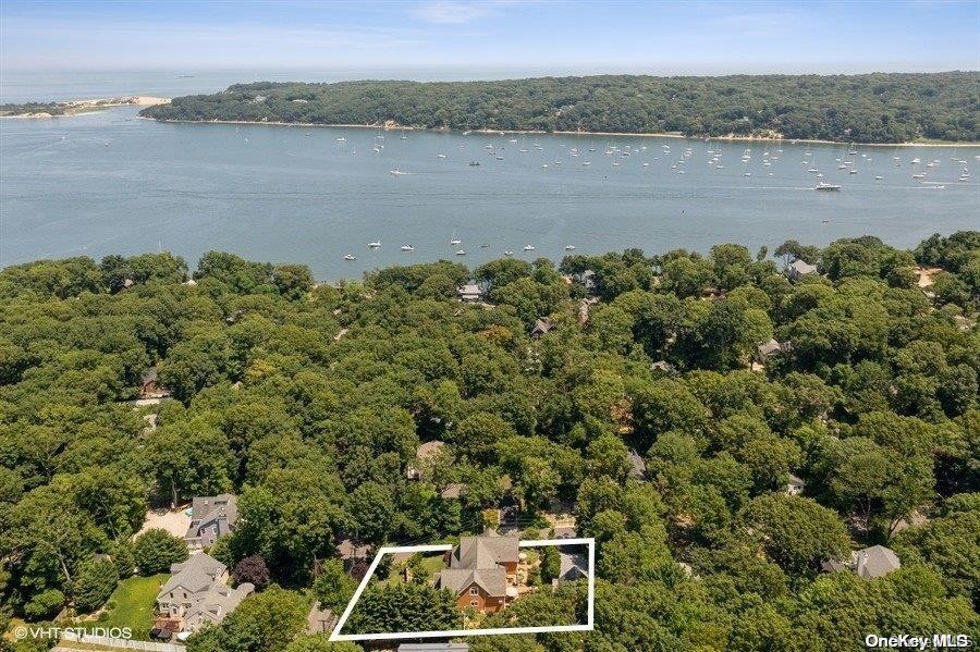 2 Cedar Avenue Setauket, NY 11733 - Photo 1 of 1 a view of a lake with a mountain in the background