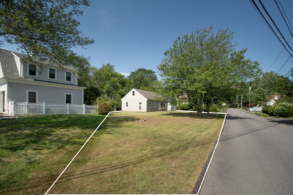 15 Cushing Road Cohasset, MA 02025 - Photo 4 of 16 a view of a house with a backyard