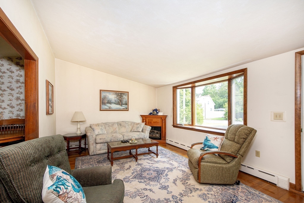 15 Cushing Road Cohasset, MA 02025 - Photo 9 of 16 a living room with furniture and a window