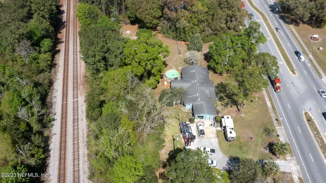 an aerial view of a residential houses with outdoor space