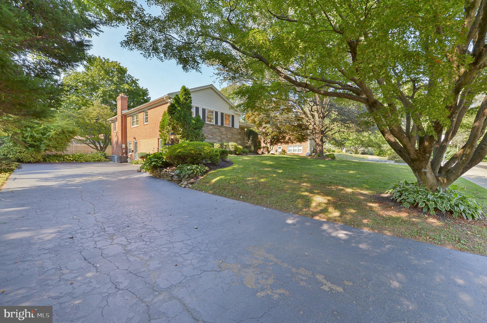 1205 Manoa Road Wynnewood, PA 19096 - Photo 4 of 44 Driveway and front yard with Japenese Maple