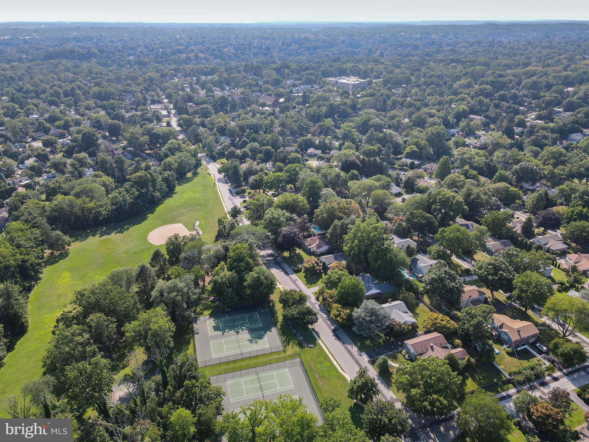 1205 Manoa Road Wynnewood, PA 19096 - Photo 42 of 44 Aerial of park, tennis courts and neighborhood