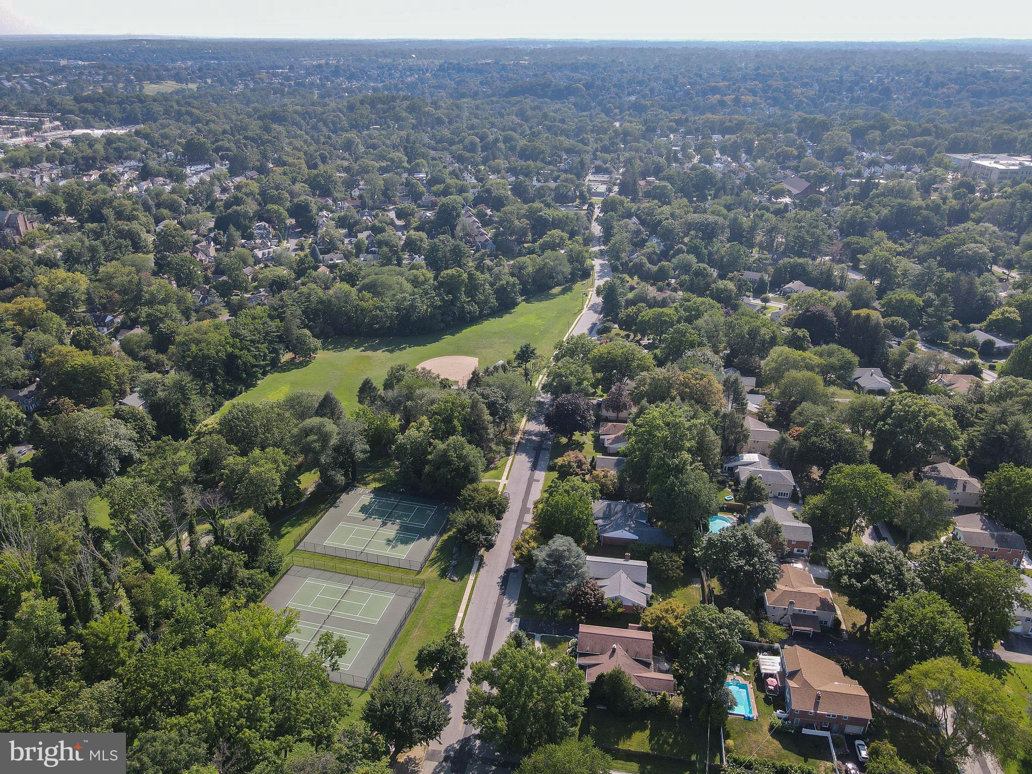 1205 Manoa Road Wynnewood, PA 19096 - Photo 43 of 44 Aerial of neighborhood, park, and tennis courts